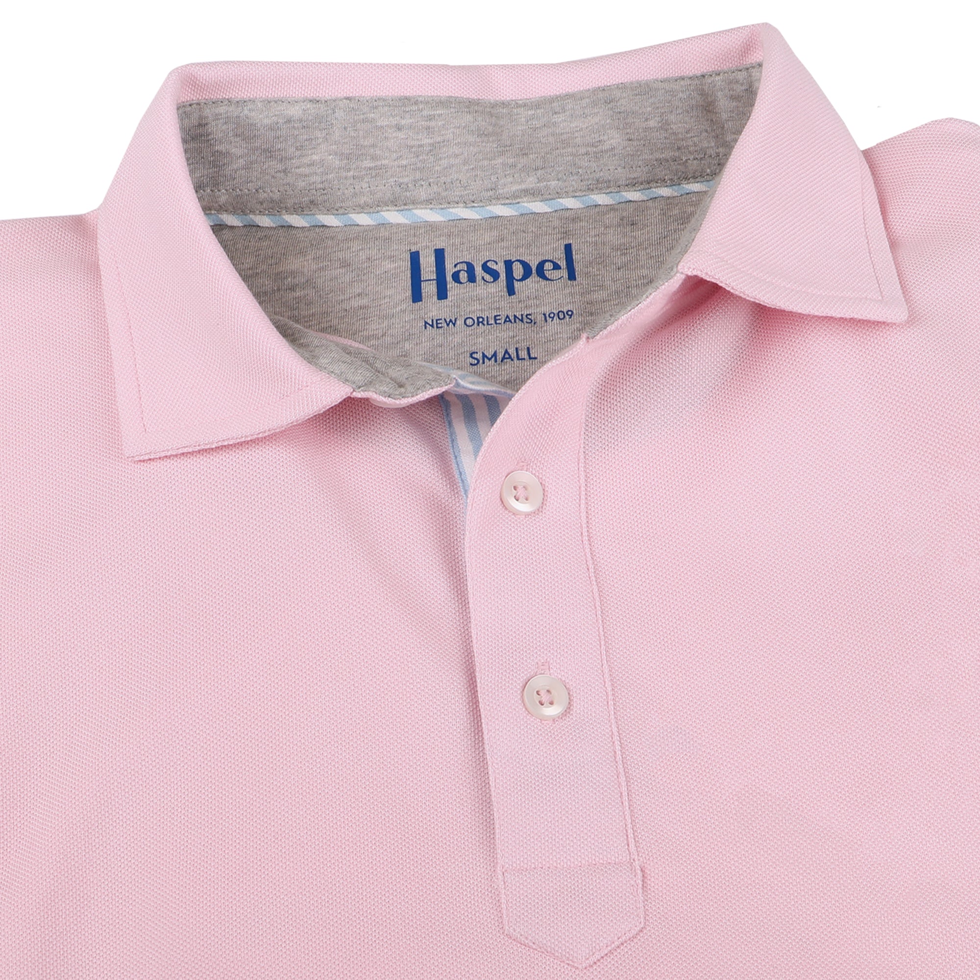 The softest pique polo to ever drape your statuesque torso. Enjoy that future perma-grin as you experience the touch and feel of a shirt that's simple in nature but exudes the quality of a Haspel man.  Our Signature Seersucker Piping and Placket • 3 Button Placket • Open Sleeve • Tagless/Printed Label for Ultimate Comfort • Stretch Comfort • 60% Cotton / 40% Polyester • Machine Washable • Return Policy