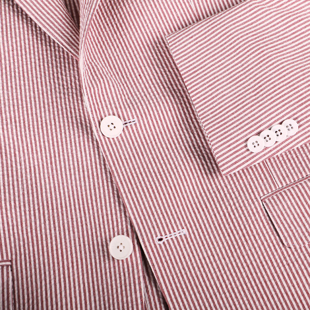 Hurricane? The cocktail or the storm? Locals get it and you&#39;ll get it too when you&#39;re chilling out in our red hurricane inspired seersucker. You&#39;re ready for anything life brings at you.   97% Cotton / 3% Lycra Haspel Exclusive Seersucker Stretch Fabric • Maximized Seersucker Pucker • Audubon Classic Fit • Natural Shoulder • Two Buttons • Flap Pockets • 3/4 Lined for Maximum Cool • Side Vents • Notch Lapel • Dry Clean • Made in USA