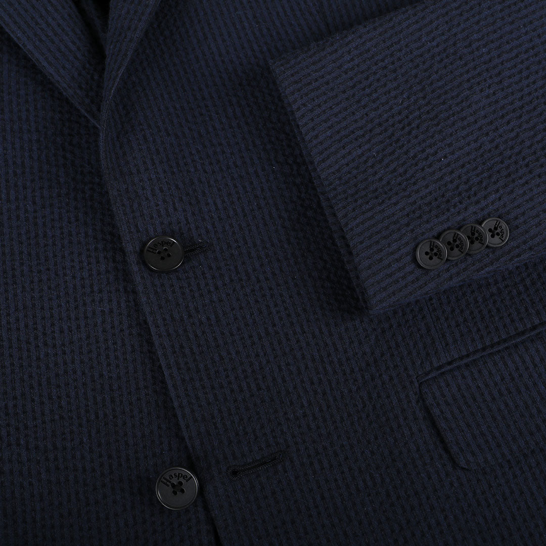 A nod to one of our favorite New Orleans cocktails, spiced with the warmth of cognac. Navy spiced up with the worlds best seersucker pucker. Always cool.   97% Cotton / 3% Lycra Haspel Exclusive Seersucker Stretch Fabric  •  Maximized Seersucker Pucker  •  Audubon Classic Fit  •  Natural Shoulder  •  Two Buttons  •  Flap Pockets  •  3/4 Lined for Maximum Cool  •  Side Vents  •  Notch Lapel  •  Dry Clean  •  Made in USA