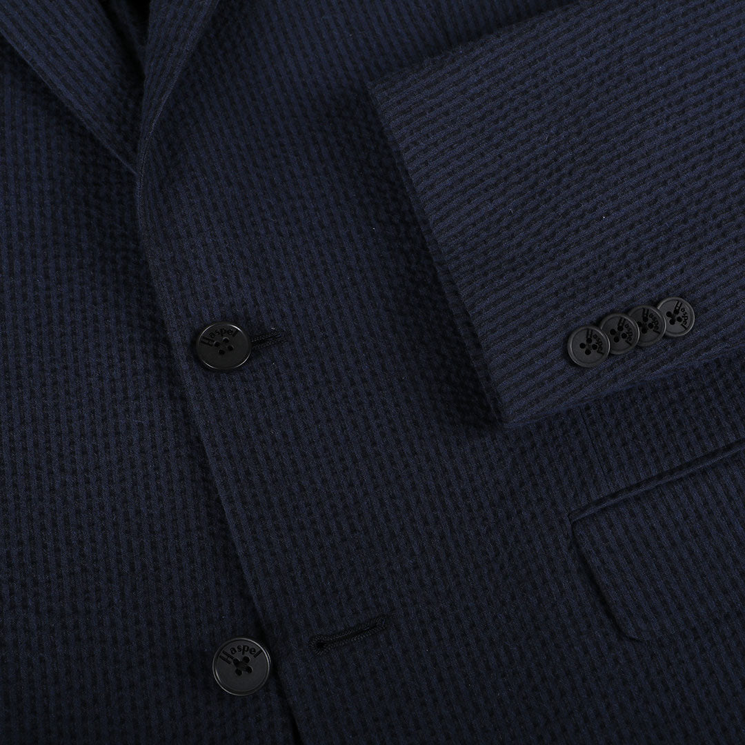 A nod to one of our favorite New Orleans cocktails, spiced with the warmth of cognac. Navy spiced up with the worlds best seersucker pucker. Always cool.   97% Cotton / 3% Lycra Haspel Exclusive Seersucker Stretch Fabric  •  Maximized Seersucker Pucker  •  Audubon Classic Fit  •  Natural Shoulder  •  Two Buttons  •  Flap Pockets  •  3/4 Lined for Maximum Cool  •  Side Vents  •  Notch Lapel  •  Dry Clean  •  Made in USA