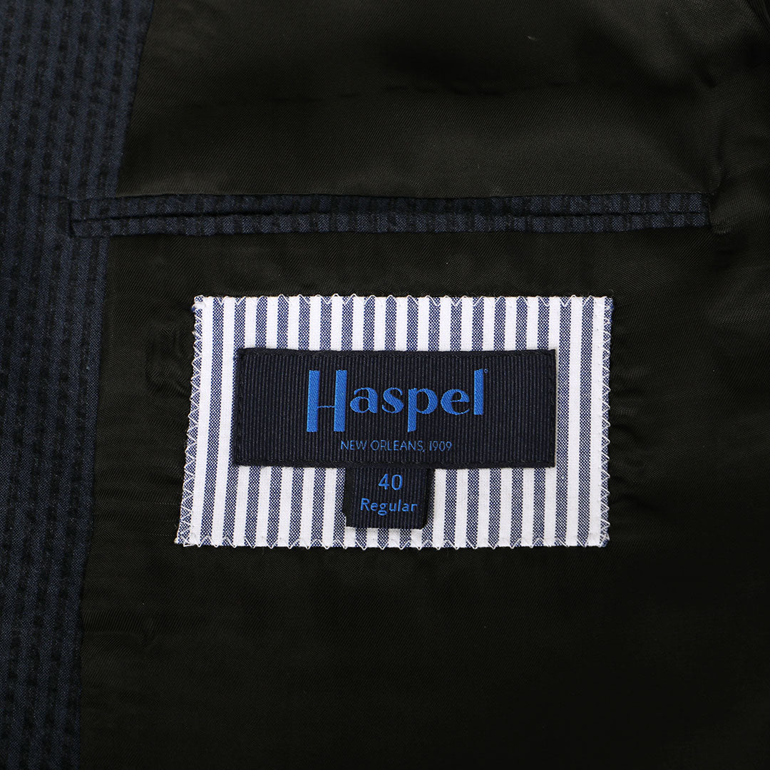 A nod to one of our favorite New Orleans cocktails, spiced with the warmth of cognac. Navy spiced up with the worlds best seersucker pucker. Always cool.   97% Cotton / 3% Lycra Haspel Exclusive Seersucker Stretch Fabric  •  Maximized Seersucker Pucker  •  Audubon Classic Fit  •  Natural Shoulder  •  Two Buttons  •  Flap Pockets  •  3/4 Lined for Maximum Cool  •  Side Vents  •  Notch Lapel  •  Dry Clean  •  Made in USA