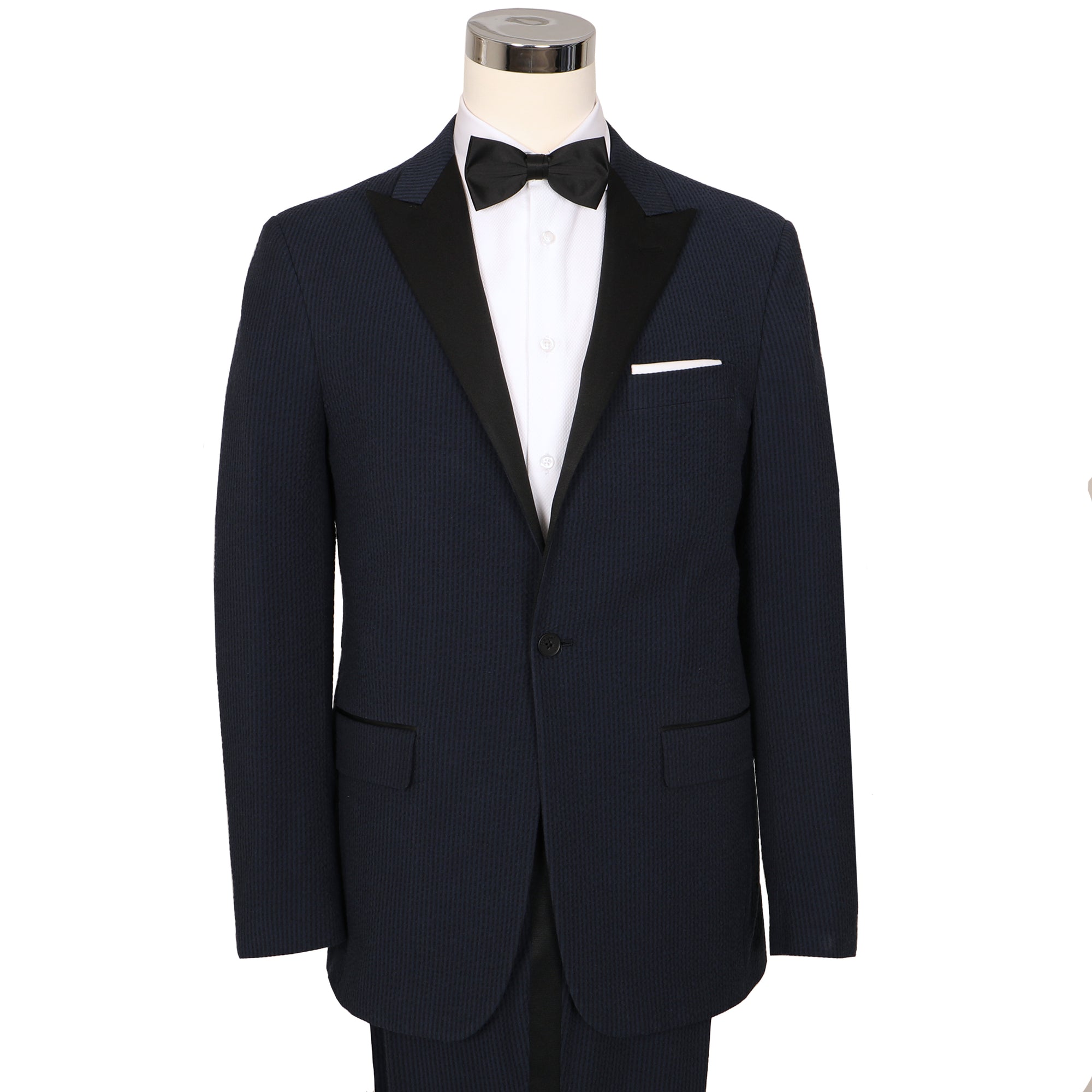 Stand out in a room full of penguins with this navy/black masterpiece. Bond ain't got nothing on you in this seersucker tux. Nail those new moves with stretch.  ** Pant waist is 6" smaller than the chest measurement. For example, if you order a 40R jacket, the pant size will be 34 **