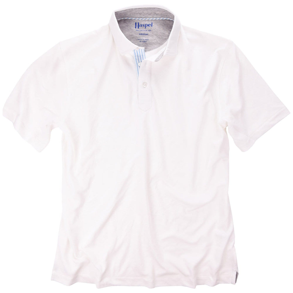 The softest pique polo to ever drape your statuesque torso. Enjoy that future perma-grin as you experience the touch and feel of a shirt that's simple in nature but exudes the quality of a Haspel man.  Our Signature Seersucker Piping and Placket • 3 Button Placket • Open Sleeve • Tagless/Printed Label for Ultimate Comfort • Stretch Comfort • 60% Cotton / 40% Polyester • Machine Washable • Return Policy