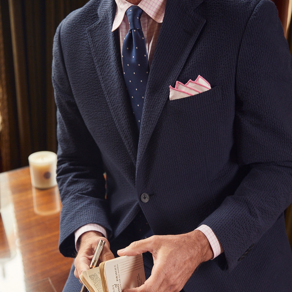 A nod to one of our favorite New Orleans cocktails, spiced with the warmth of cognac. Navy spiced up with the worlds best seersucker pucker. Always cool.   97% Cotton / 3% Lycra Haspel Exclusive Seersucker Stretch Fabric  •  Maximized Seersucker Pucker  •  Audubon Classic Fit  •  Natural Shoulder  •  Two Buttons  •  Flap Pockets  •  3/4 Lined for Maximum Cool  •  Side Vents  •  Notch Lapel  •  Dry Clean  •  Made in USA